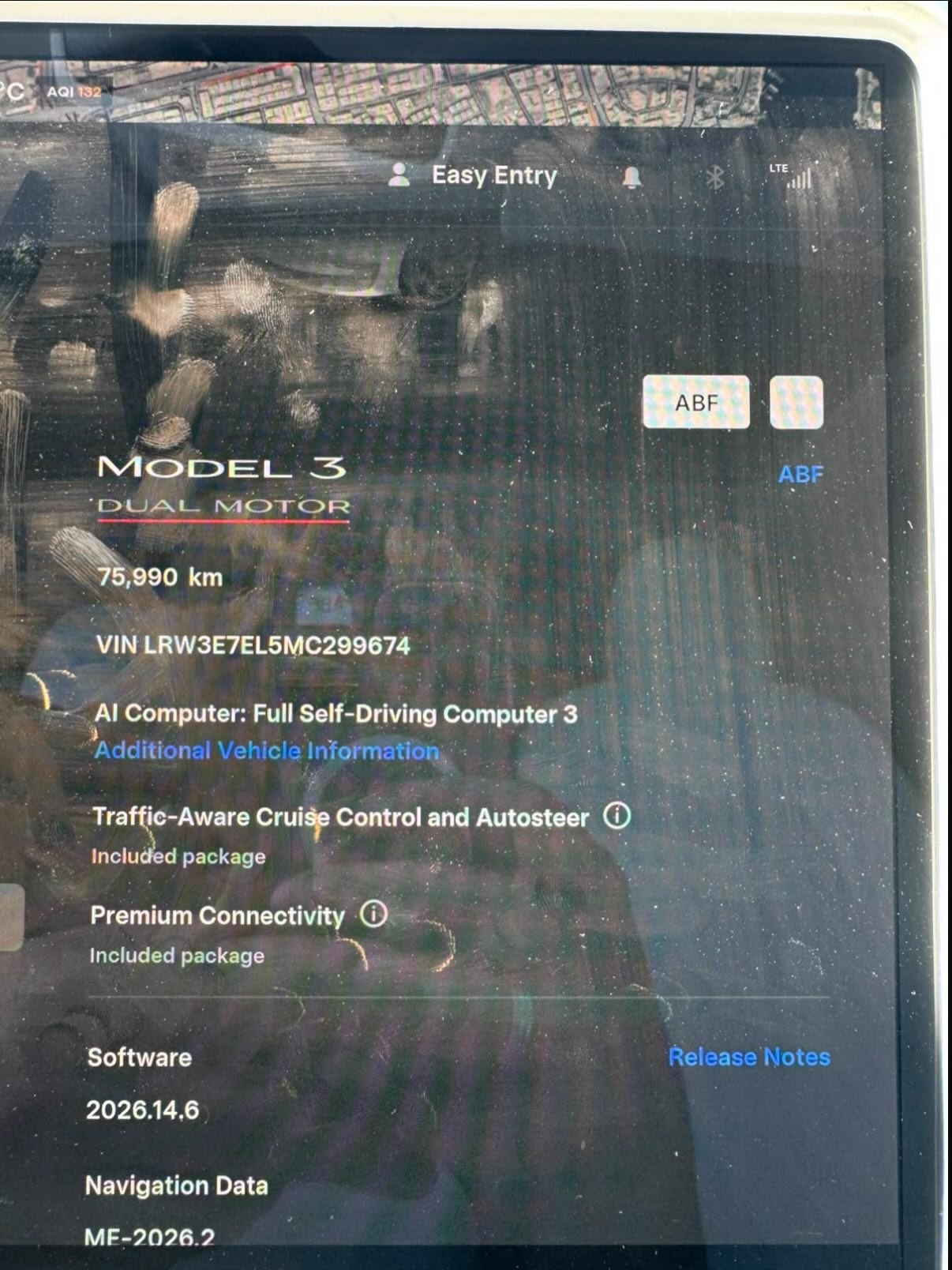 Screenshot of the dashboard of a car. The dashboard is black and has a large screen in the center. On the screen, there is a