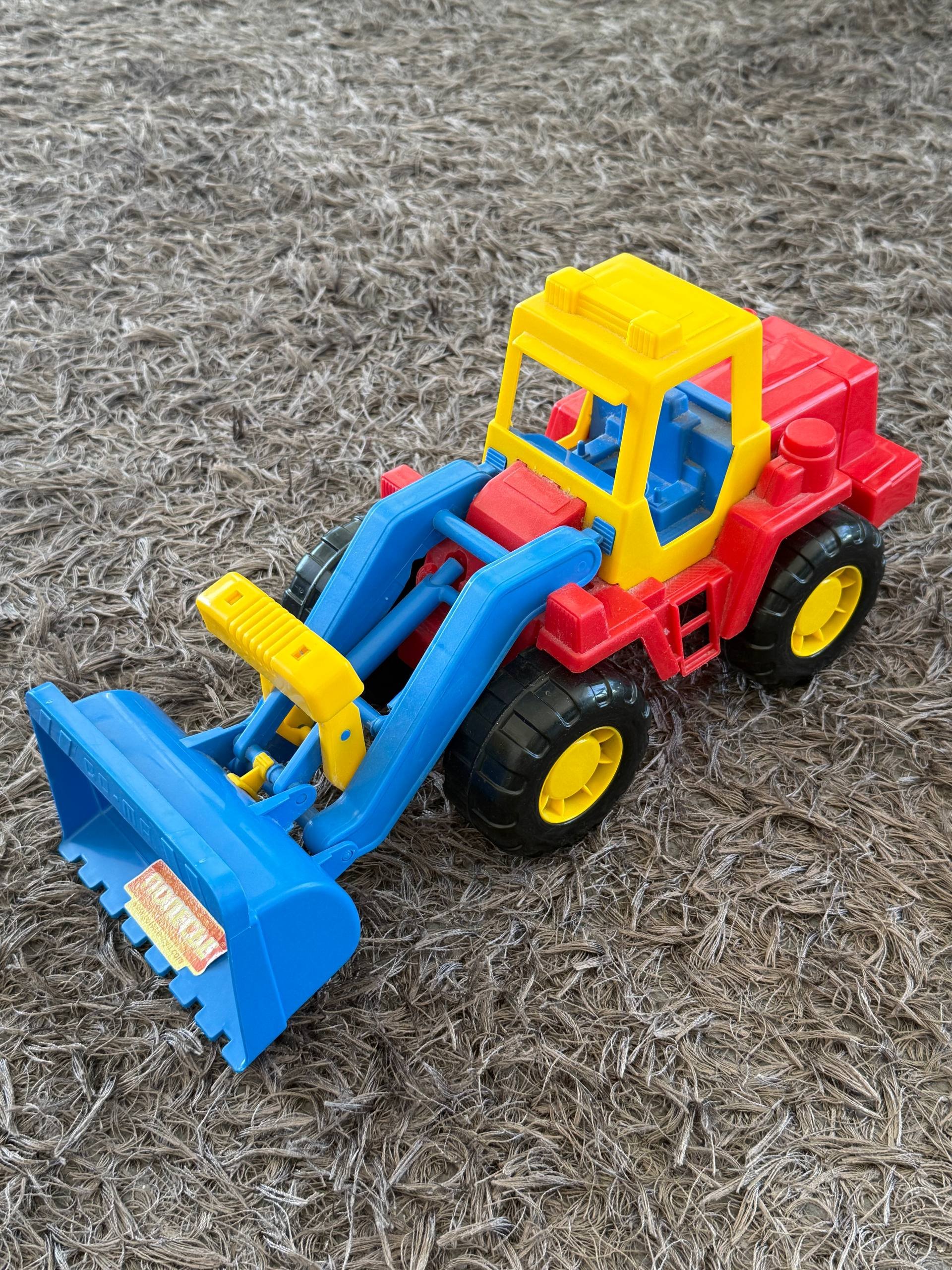 Toy bulldozer tractor for a chocolate — Limassol, Cyprus