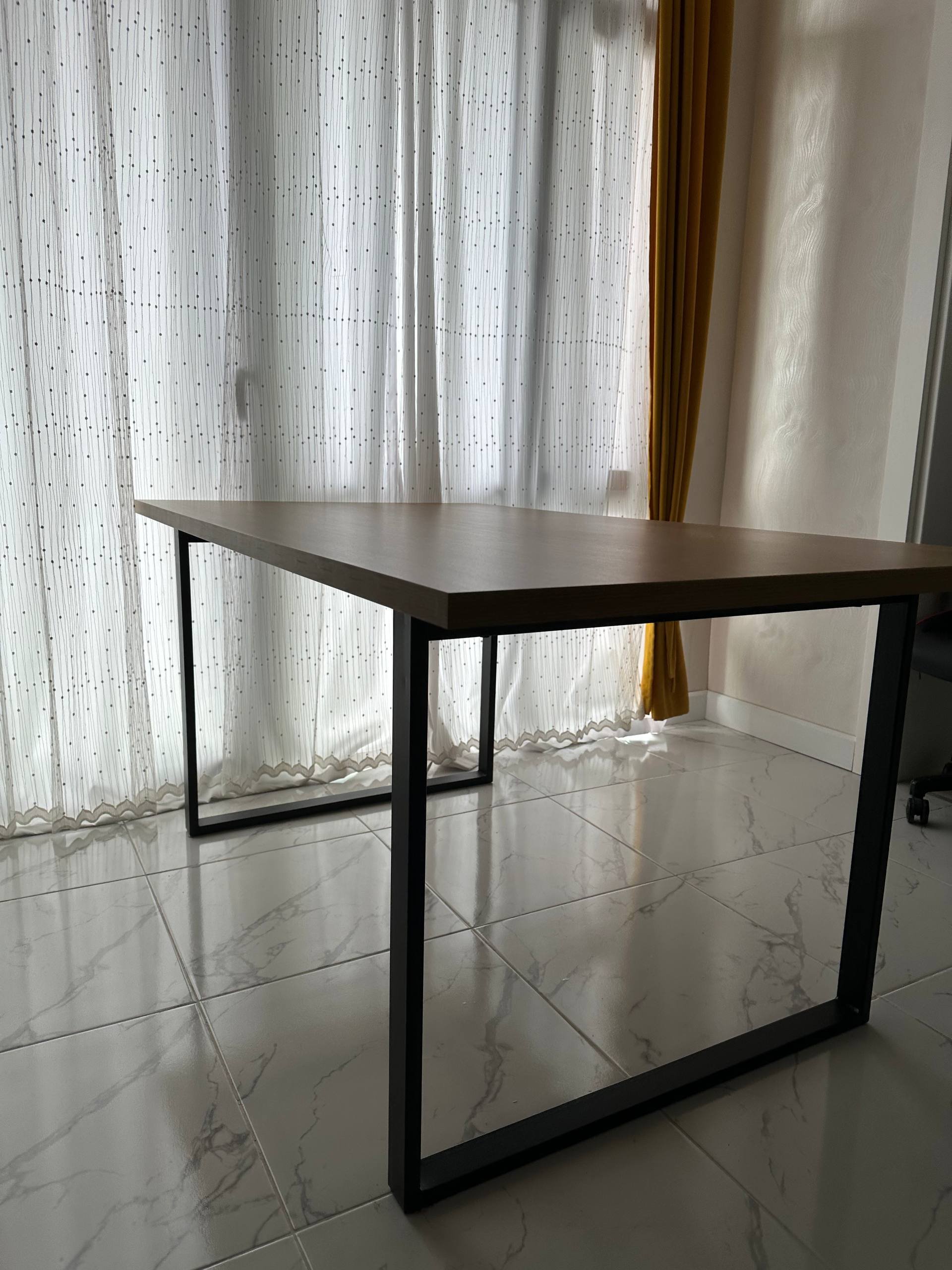 Wooden table with black metal frame — Batumi, Georgia